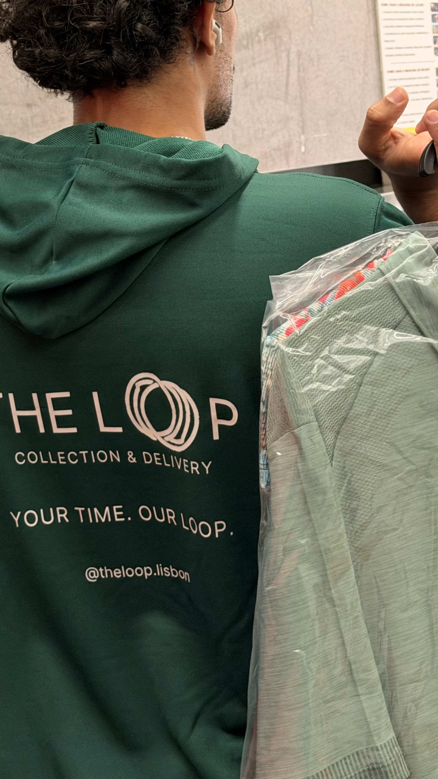 THE LOOP green sweatshirt detail during service